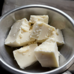 grass fed grass finished bulk tallow in a stainless steel bowl